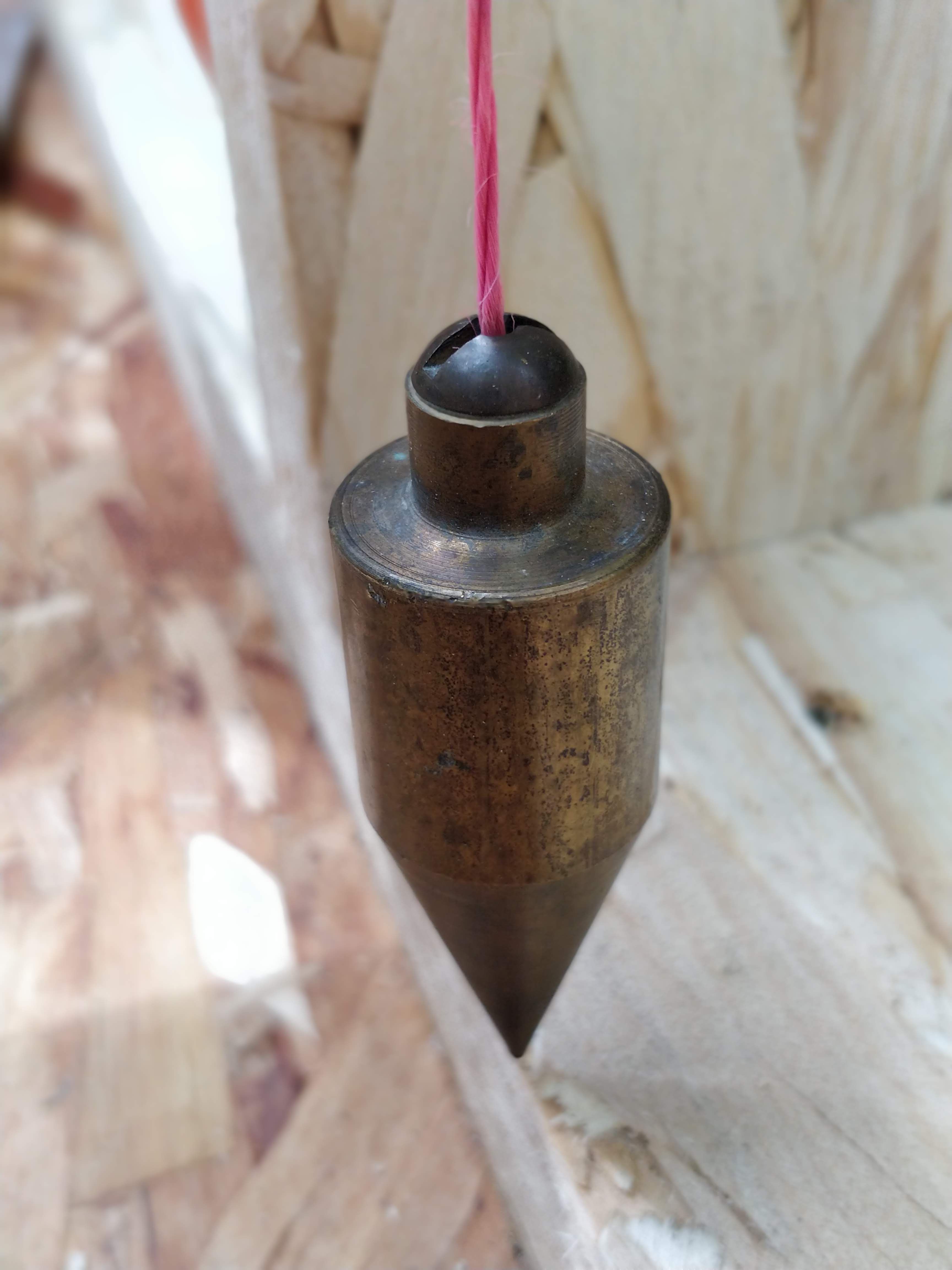 Close-up of plumb bob